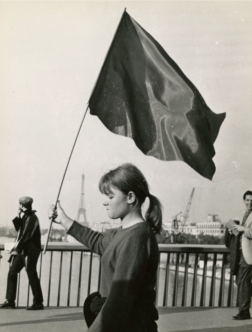 Young woman protestor with the Eiffel Tower in the background