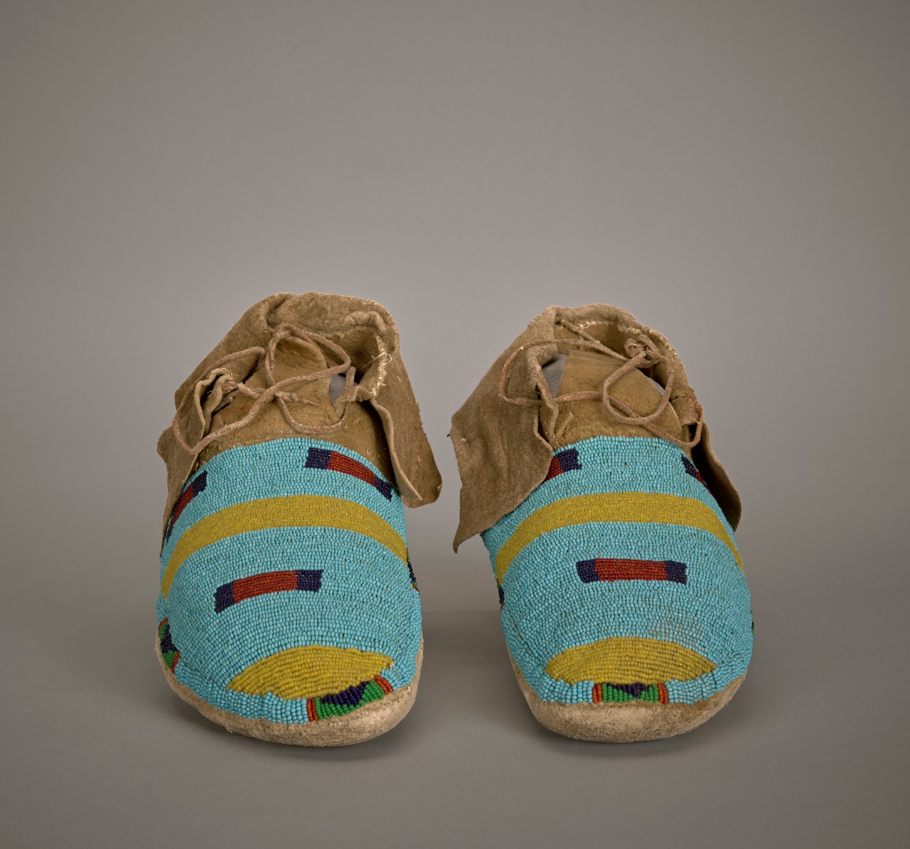 Unidentified Crow (Apsáalooke) artist, Wedding Moccasins, early 20th century, rawhide with beads