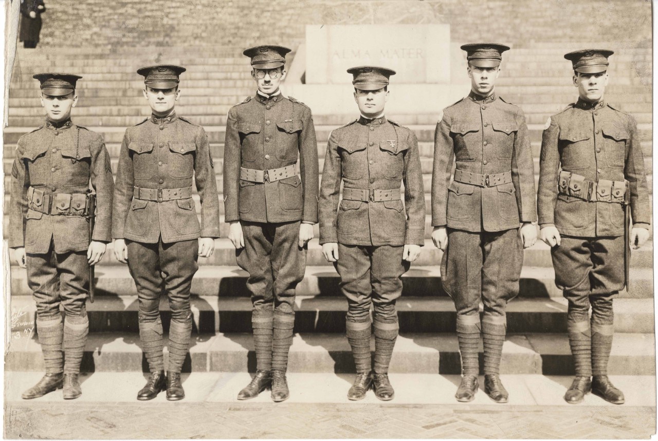 WWI ROTC members standing at attention in uniform on Low Library steps