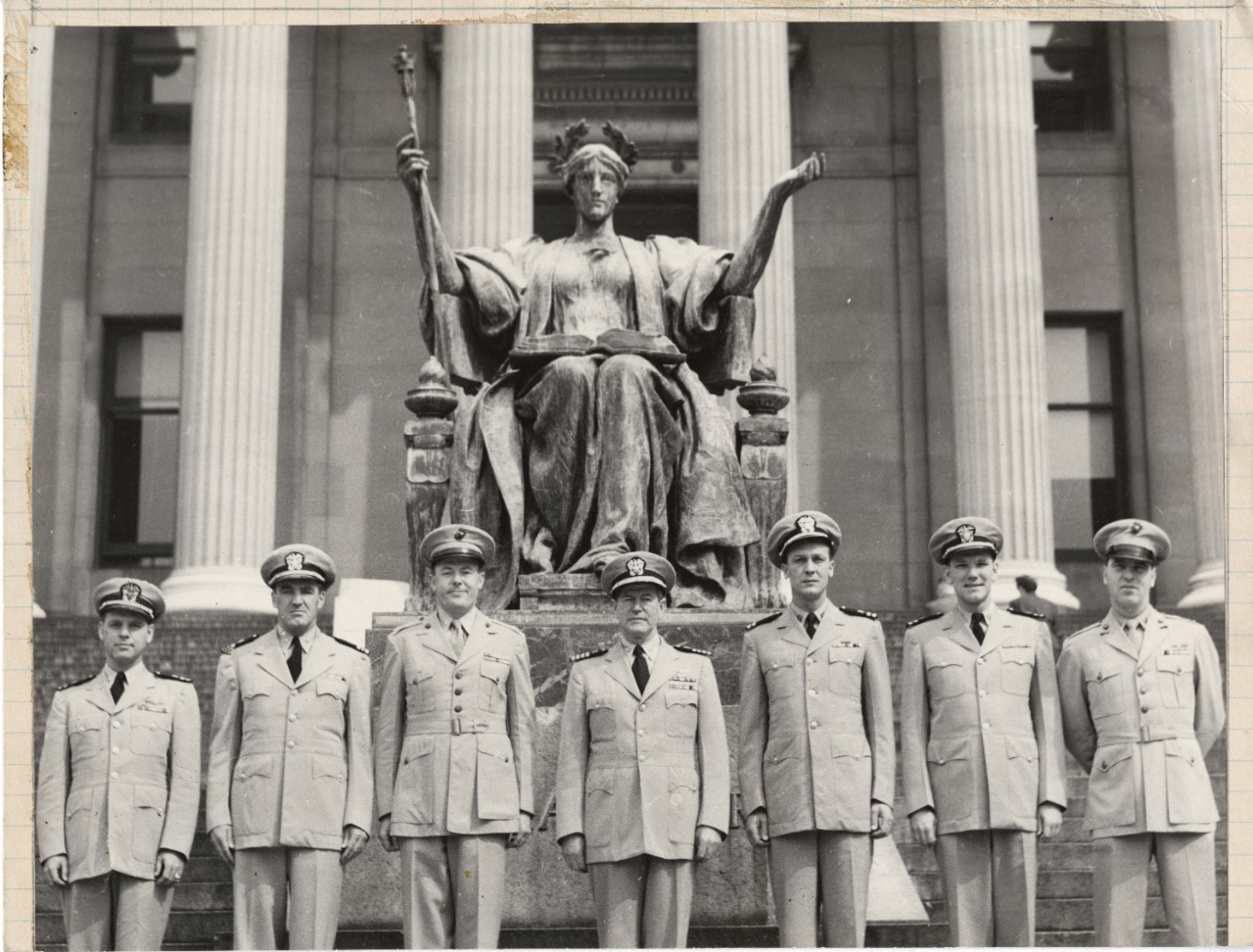 Seven NROTC officers posing in front of Alma Mater statue, 1953 Columbian.