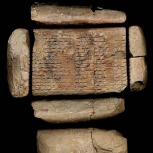 Cuneiform tablet in six pieces with writing carved into largest piece