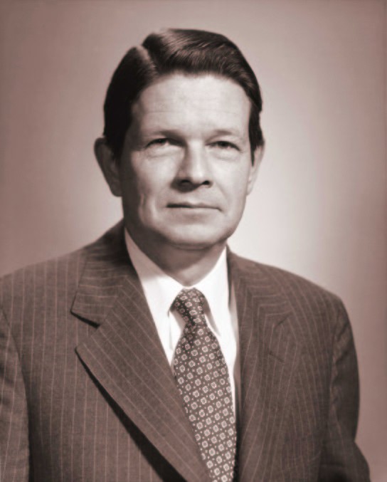 black and white portrait photo of Alan Pifer in a suit