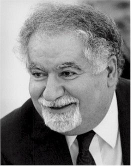 black and white photo of Vartan Gregorian in a suit smiling