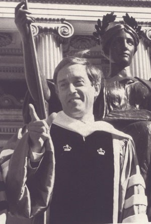 Photo of George Rupp in front of Alma Mater statue